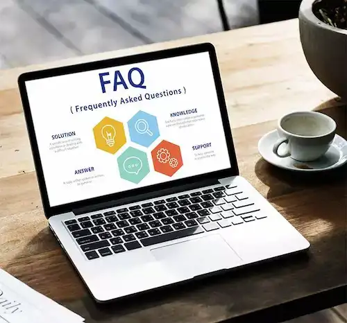 Laptop screen showing a FAQ page