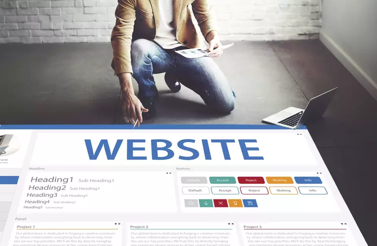 Man standing over a webpage